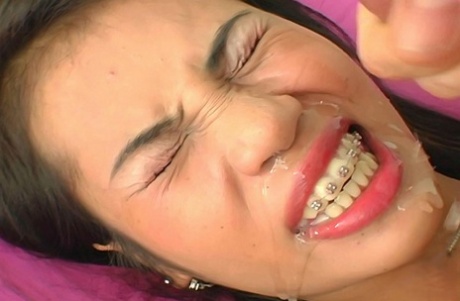 Asian Girl Nue Takes A Cumshot On Her Braces During A Closeup