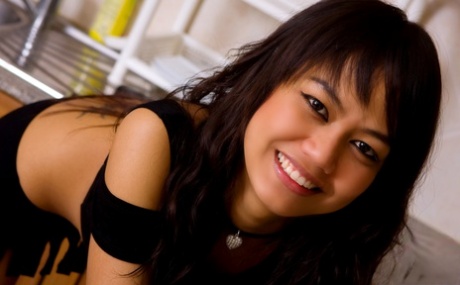 The kitchen sink is where a petite Asian girl named Fern is attacked with fishnets.