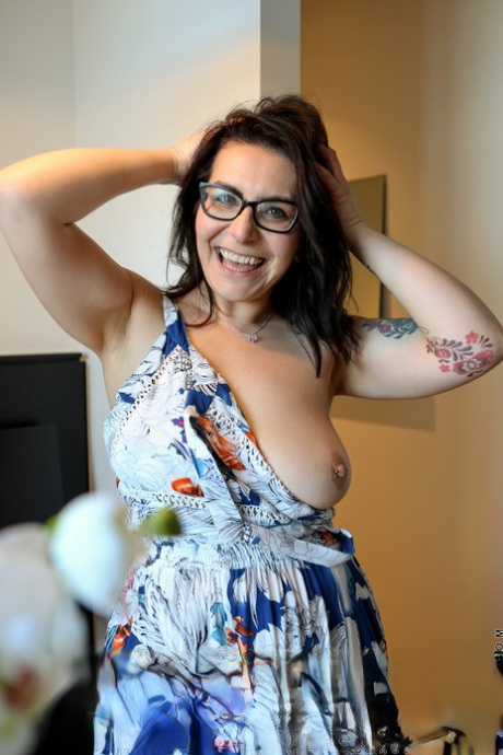 Naughty Housewife Chasey Devil Takes Off Her Clothes To Pose Naked In Glasses