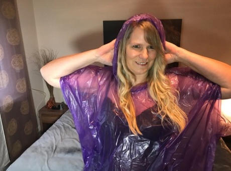 Young prostitute Sweet Susi pulls a transparent raincoat to show off her abduction.