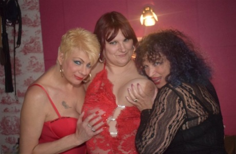 During the night, older women engage in a lesbian threesome while lying on their lingerie bed.