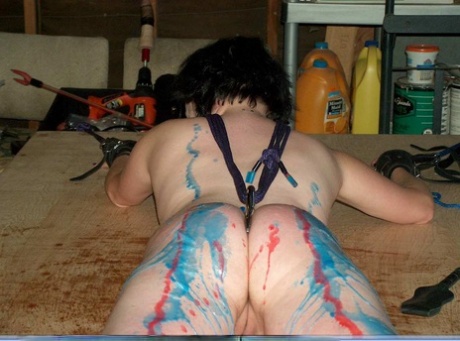 A girl with dark hair gets covered in hot wax and her posterior is encased.