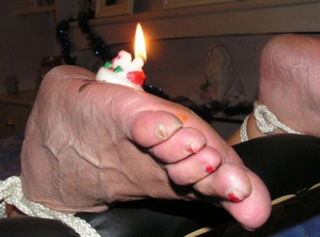 Coupled with white girl sports, candles were lit on the soles of her feet.