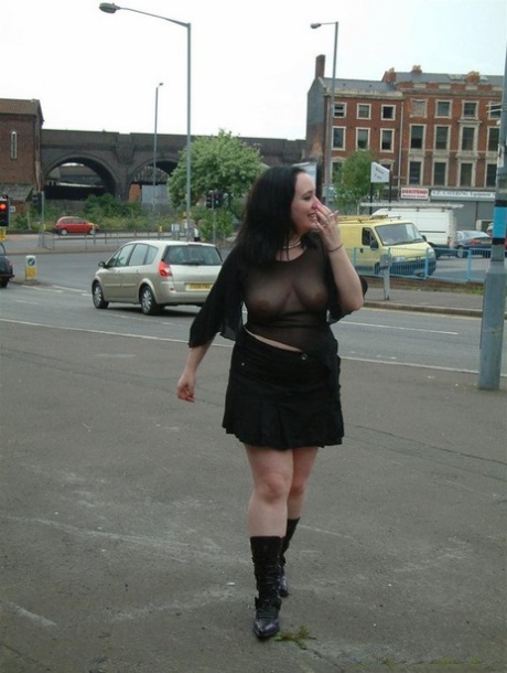 This woman is described as a dark-haired pumper who wears a transparent top and walks around in public.