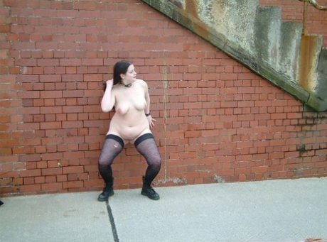 Fat British slave lets loose with her nylons in the alley.