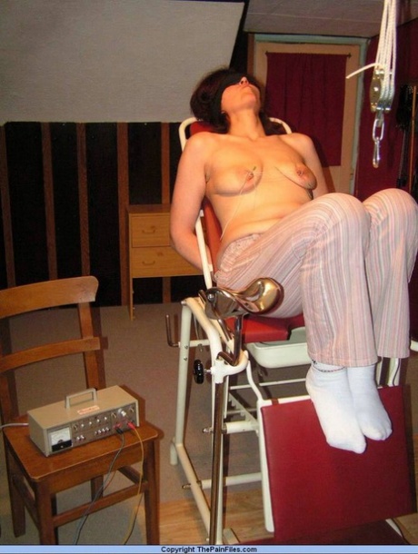 A white woman is tortured while having her nipples blindfolded.