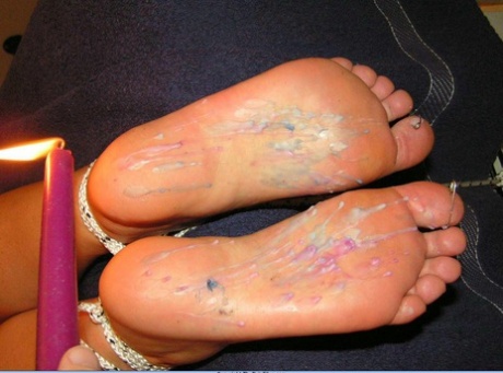 The Pain Files inflicts hot candle wax on the feet.