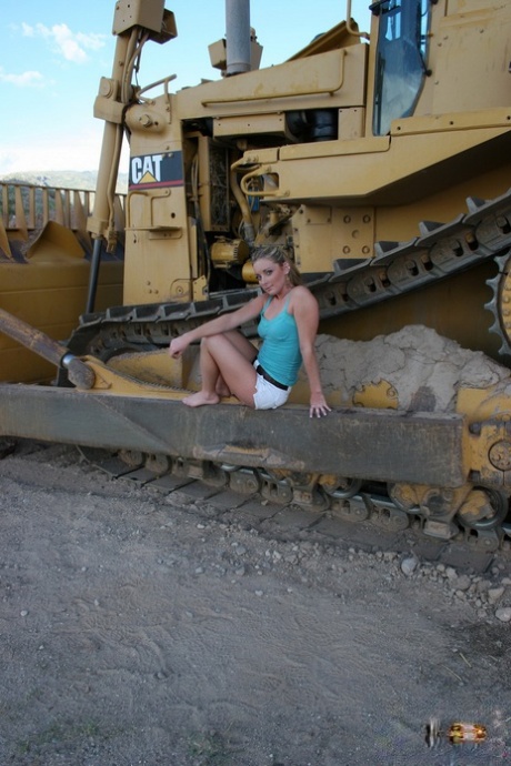 Teen first timer Abbie gets totally naked on tracks of heavy equipment