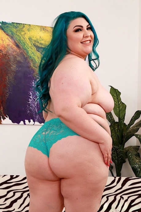 Older woman Bella Bendz wears long dyed hair and naked in high heels.