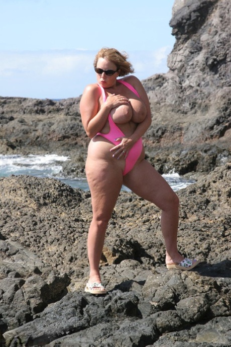 Amateur BBW Curvy Claire Sets Her Large Breasts Free On Seaside Rocks
