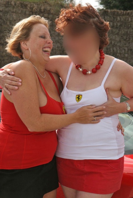 UK-based Curvy Claire and her lesbian partner engage in groping behavior while wearing miniskirts.