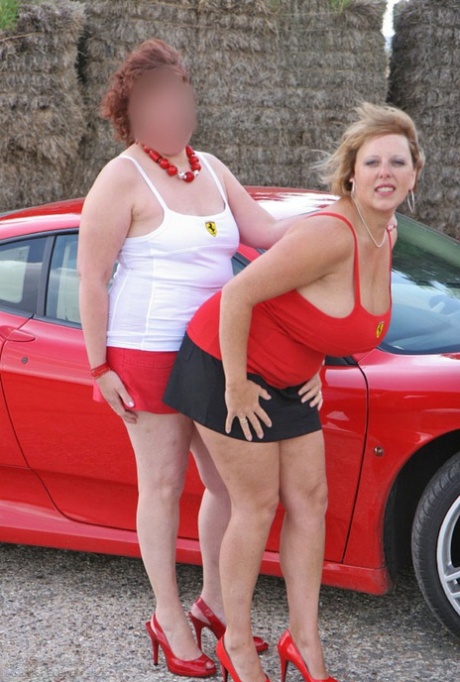 The girlfriend of Curvy Claire, a British lesbian, models miniskirts and red heels.