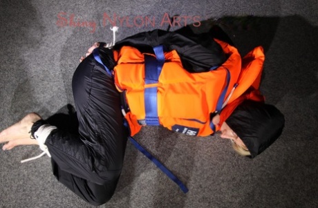 Witness Sonja's choice of blue rainwear and a life jacket while being dressed up in the sun.