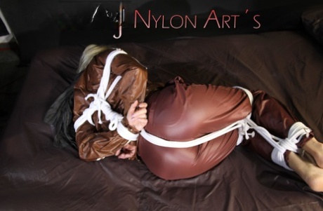 Watch as the attractive Sonja is tying and gagged on a bed with ropes and a clothgapper in the bedroom.