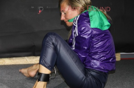 Sandra was spotted wearing shiny nylon rain pants and a rain jacket tie.