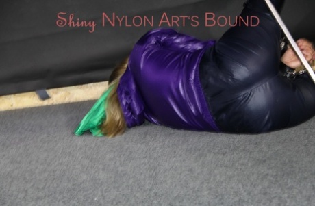 A look at the top of Sandra's shiny nylon rain pants and a rain jacket tie.