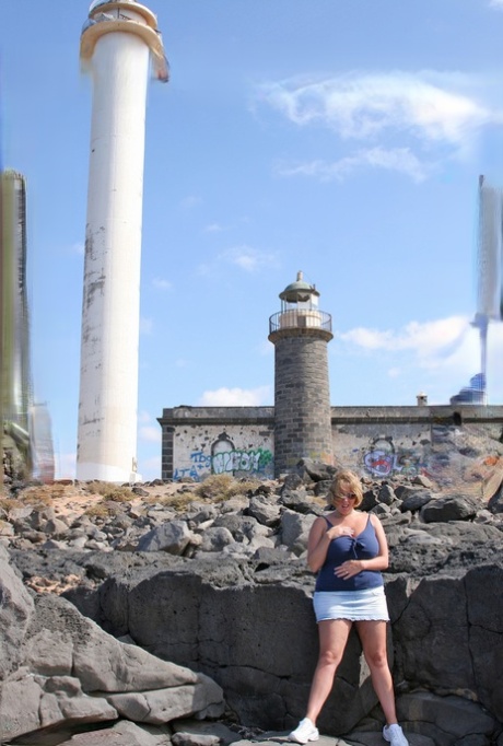 BBW Curvy Claire from Britain displays her prominent breasts during a visit to a lighthouse.