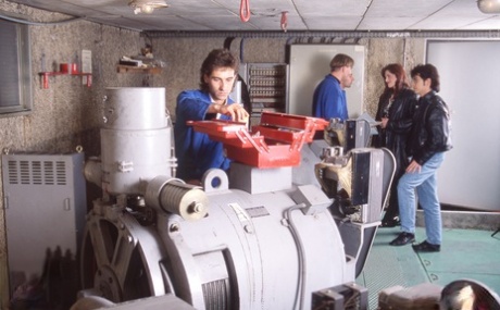 The female factory owner receives a duod during a gangbasting with male workers.