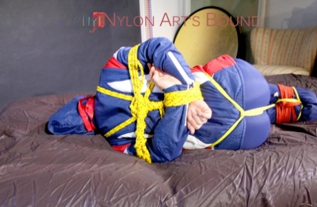 With ropes attached to HOT HOT HOT SANDRA, the floor is covered with a cloth gag for ventilation.