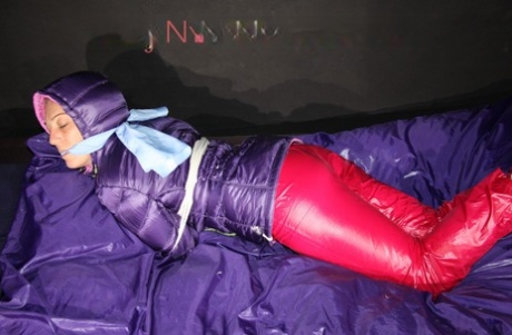 A sexy Sophie who is gagged, tied, and hooded with ropes, while also being clothgagged.