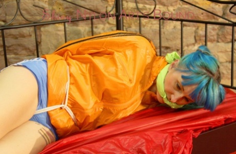 On a princess bed in an old cellar, Mara was draped in a super-sexy outfit and tied and gagging.