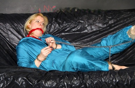 The super-cute oldschool downsuit with green ties and Pia's gagging pose on the floor.