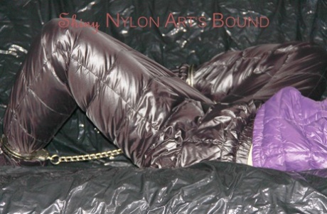 A sofa with cuffs and an ornate pillory in hot purple caused Sandra to be tied up and gagged.