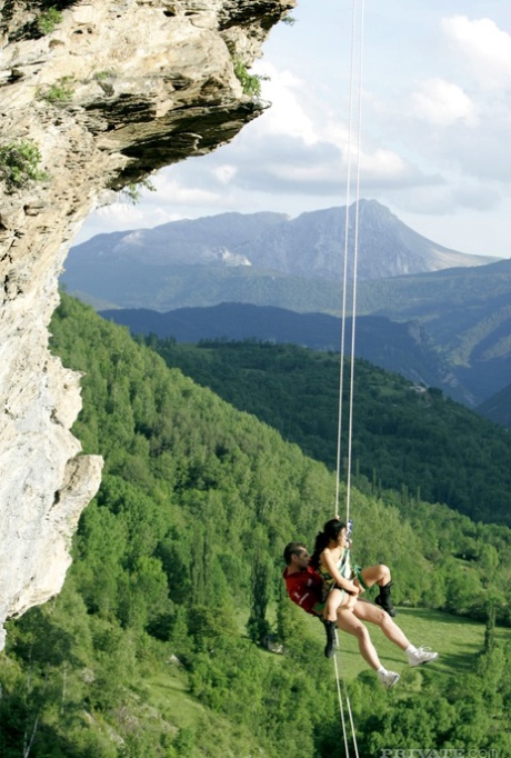 The unprepared Asian mountaineer's guide is rescued by a hot woman.