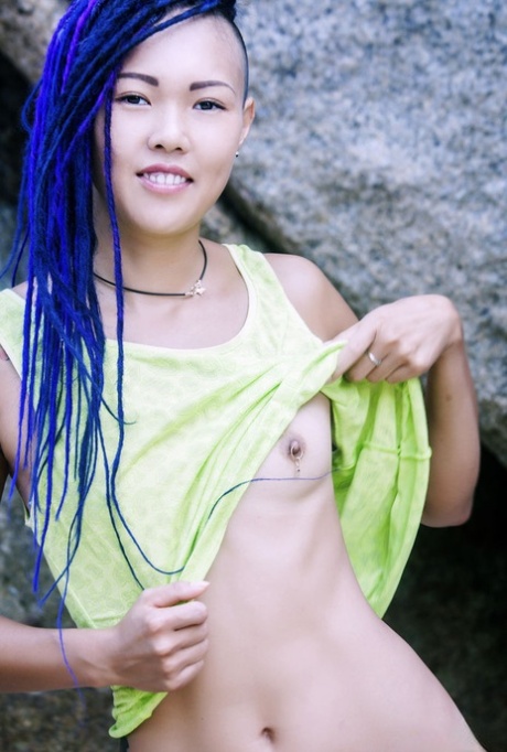 In a sea cave, Sweet Julie, an Asian girl, goes completely naked.