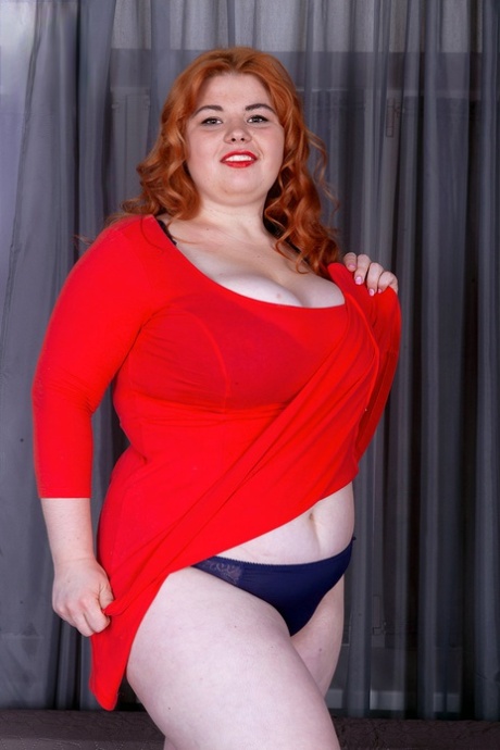 Fat Redhead Loida Holds Her Huge Boobs After Removing Red Dress And Lingerie