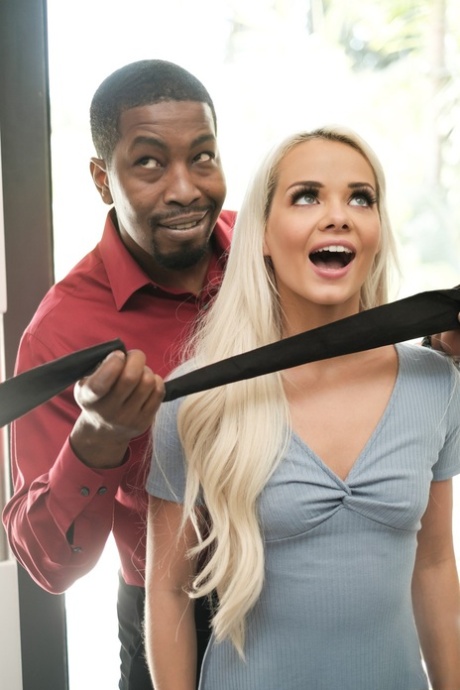 Hot girl Elsa Jean is freed from a blindfold prior to her interracial fucking