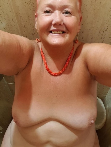 Valgasmic Exposed' chubby woman with red hair takes nude photos at her home.