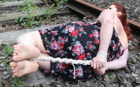 Natural Redhead Is Left Hog Tied And Gagged On Railway Tracks