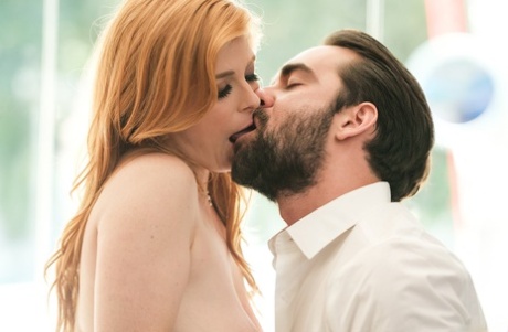 Natural redhead Penny Pax seduces a businessman in ankle strap heels