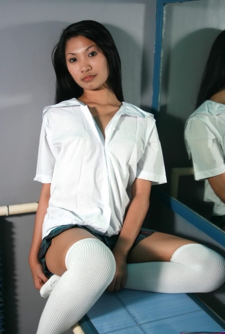 Asian Teen Rubs Her Horny Pussy While Wearing Over The Knee Socks