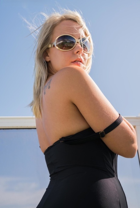 Hot Blonde Frees Her Nice Tits From A Swimsuit On A Rooftop In Designer Shades
