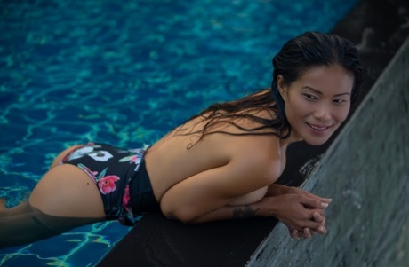 Asian Model Maki Katana Sports The Wet Look For A Centerfold Shoot