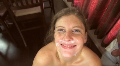 A girl who is an amateur takes a daring step and covers her face with ejaculate at home.