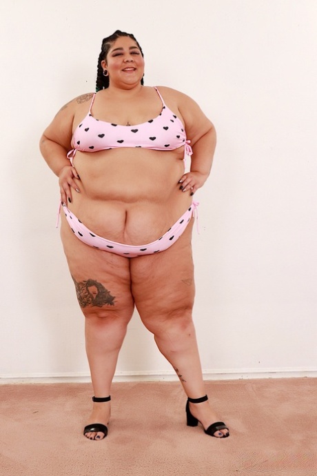 SSBBW Crystal Blue removes a bra and panty set to pose naked in shoes