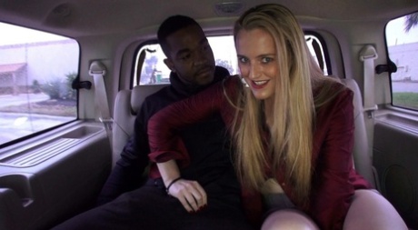 Sexual activity: A blonde first-timer has been having sex with this black boy in the back seat of an automobile.