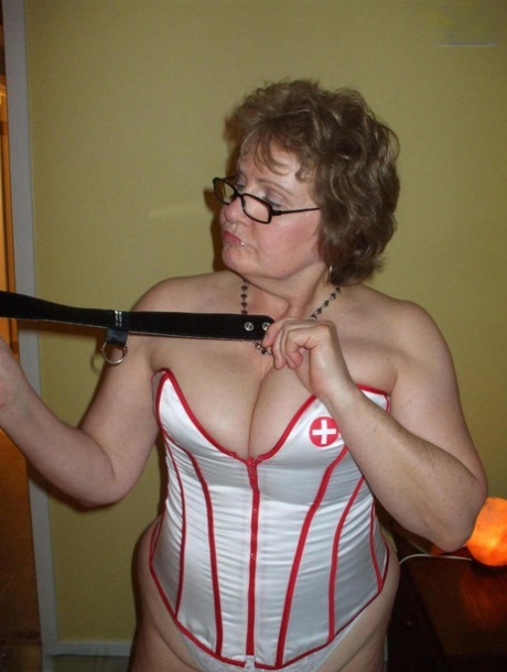 Despite being an older amateur, Busty Bliss goes for POV play while wearing a nurse's corset.