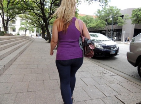 In a car, an overweight woman exposes herself to the elements with her twat and buttockbone in public before engaging in a fist fight.