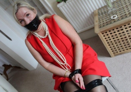 Older Blonde Is Tied Up, Gagged And Blindfolded In A Few Outfits