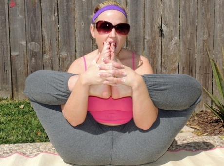 The big ass of Dee Siren is revealed while practicing yoga near a pool due to her weight and appearance.