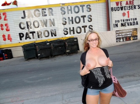 A naked Dee Siren poses for a picture before flashing his lights in a car and restaurant.