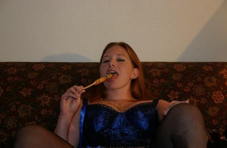 Redheaded MILF Slips A Stick Of Candy Inside Her Shaved Pussy