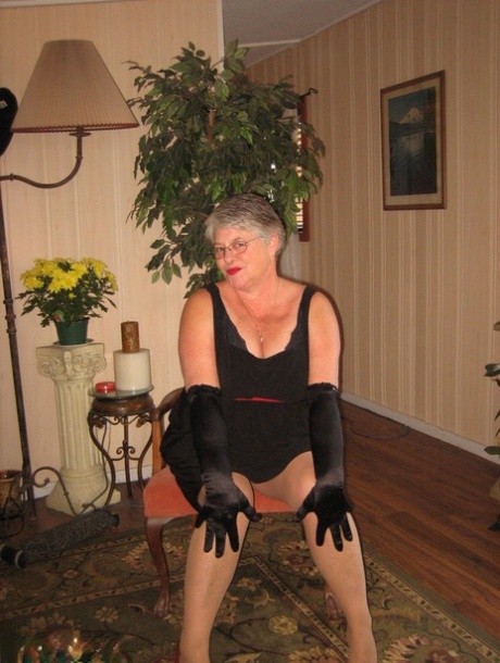 The Girdle Goddess fondles and saggy tits were wrapped in black velvet gloves and hose.