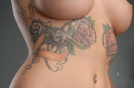 The tattooed body of aspiring model Emily Parker is captured in closeups.