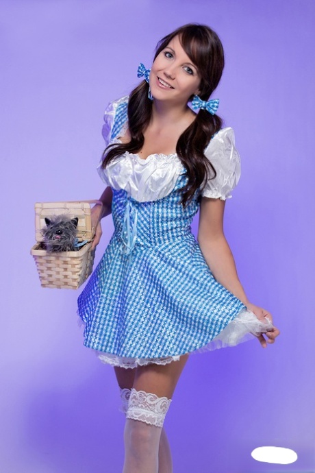 Young and adorable Andi Land loosens her tits/pussy from cosplay clothing.