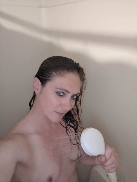 Amateur chick takes selfies during a masturbation session in a shower